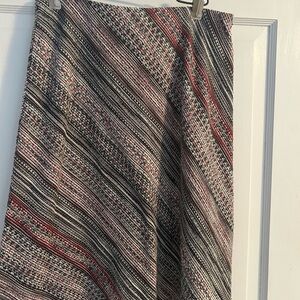 Women’s multi color skirt that falls below the knees. Great for summer